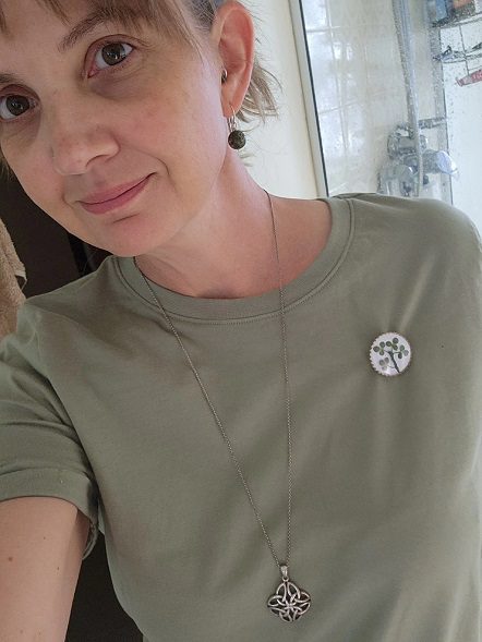 20230317_075022 Photograph of librarian wearing shamrock brooch